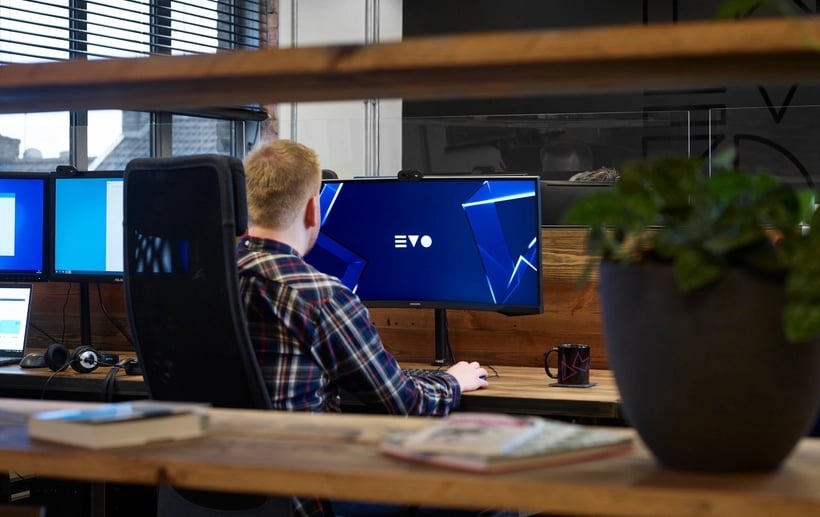 A person and computer screen in the Evo Agency studio