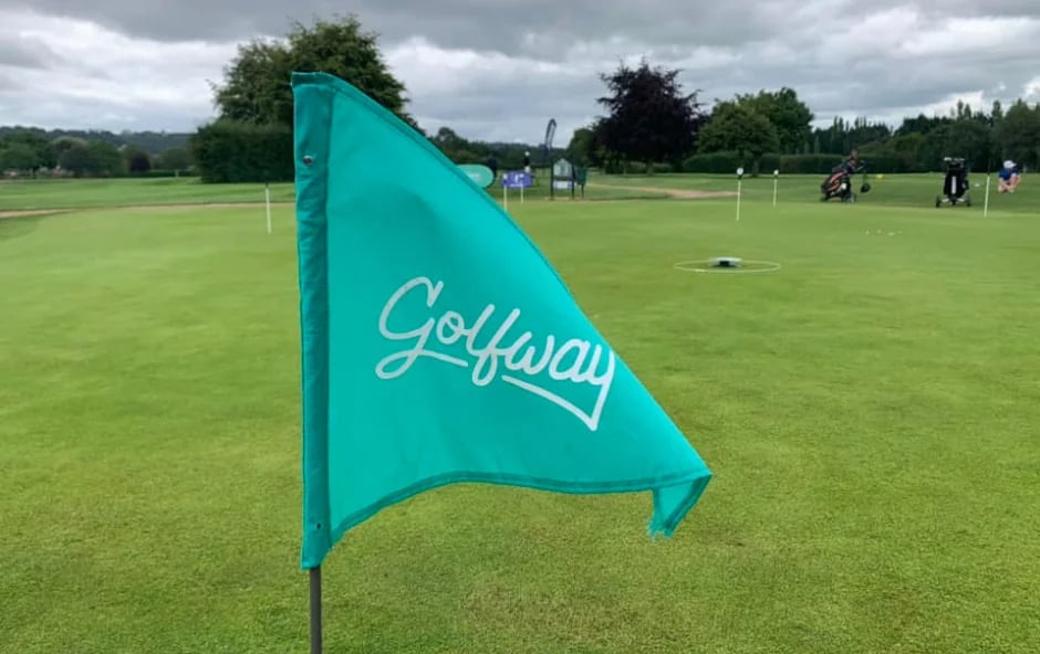Golfway flag flying on the course